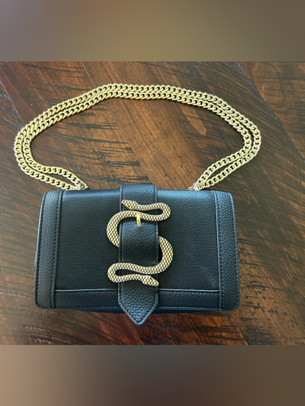 Express Black Crossbody Bag with Gold Snake Accent